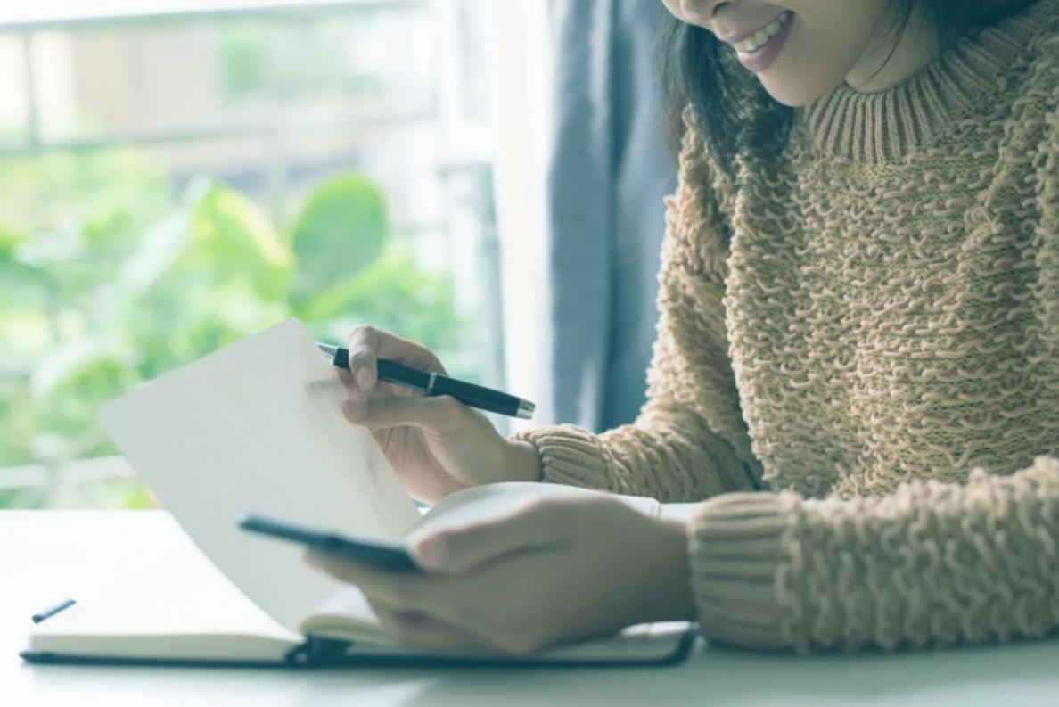 Instructor reviewing financial charts with student during investing education session